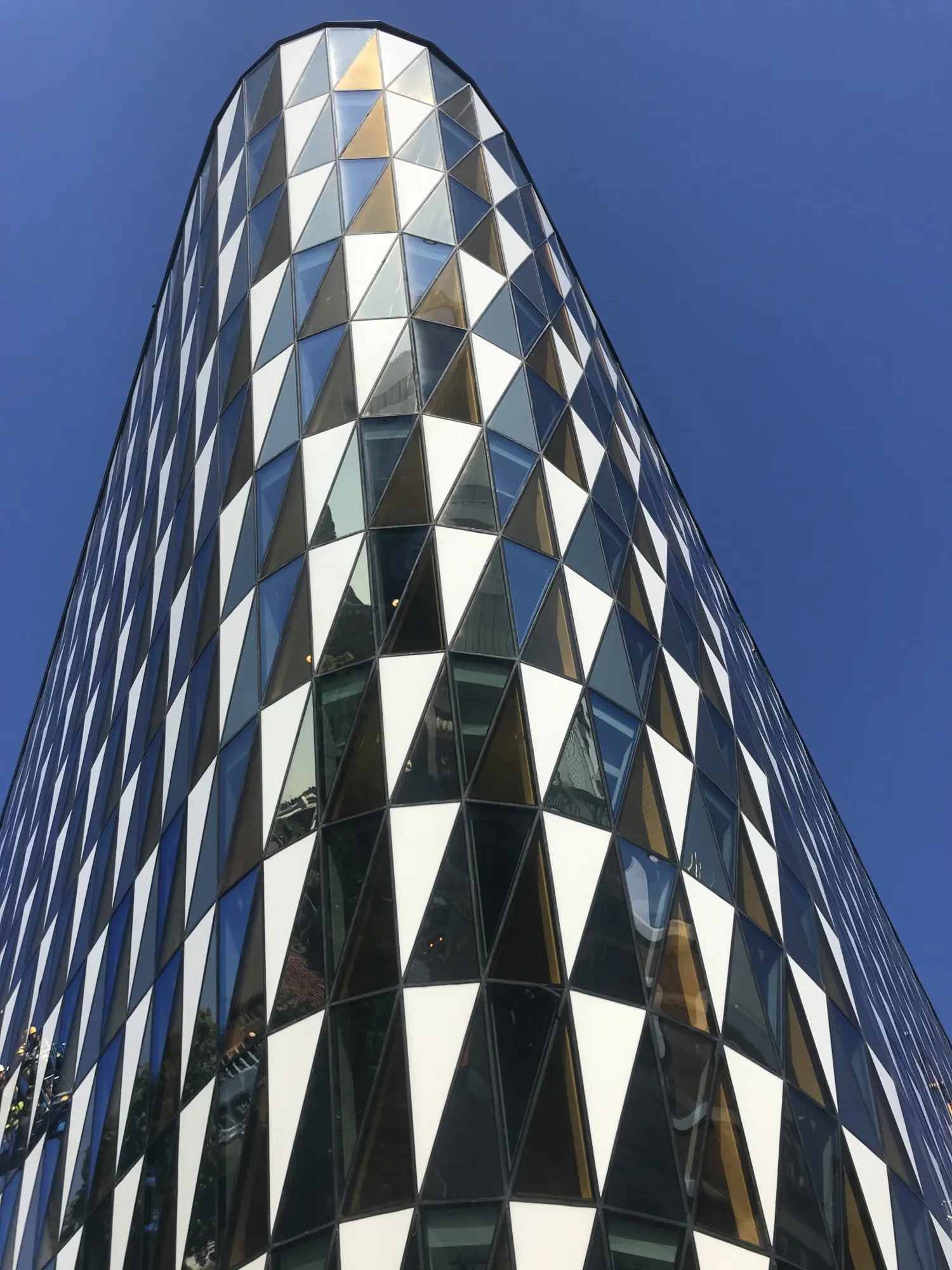 Aula Medica sharp angle, against blue sky.