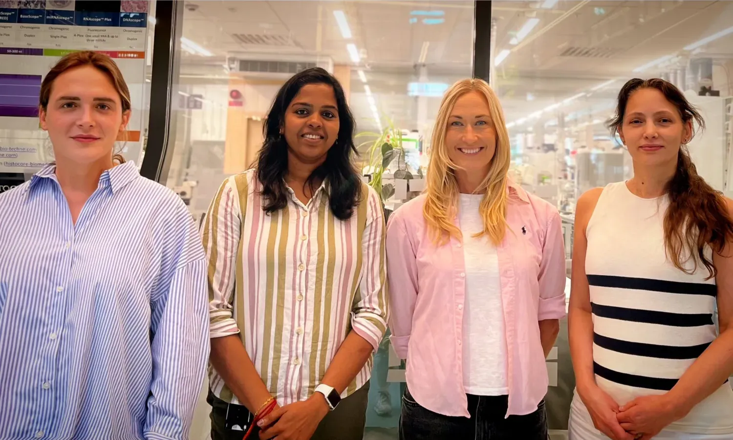 The staff standing outside the core facility in Biomedicum.