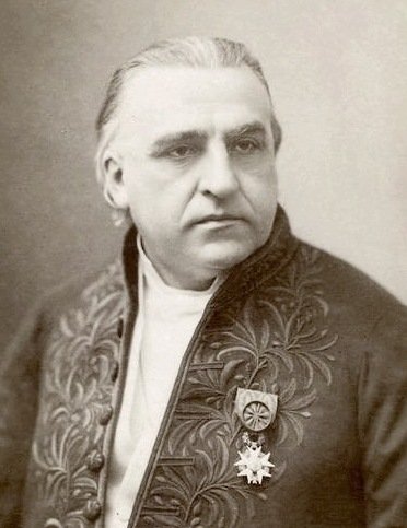 Historisk bild på äldre man i svart kavaj.