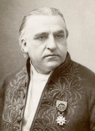 Historical image of elderly man in black jacket.