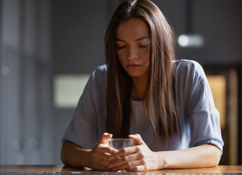 A woman drinking alcohol
