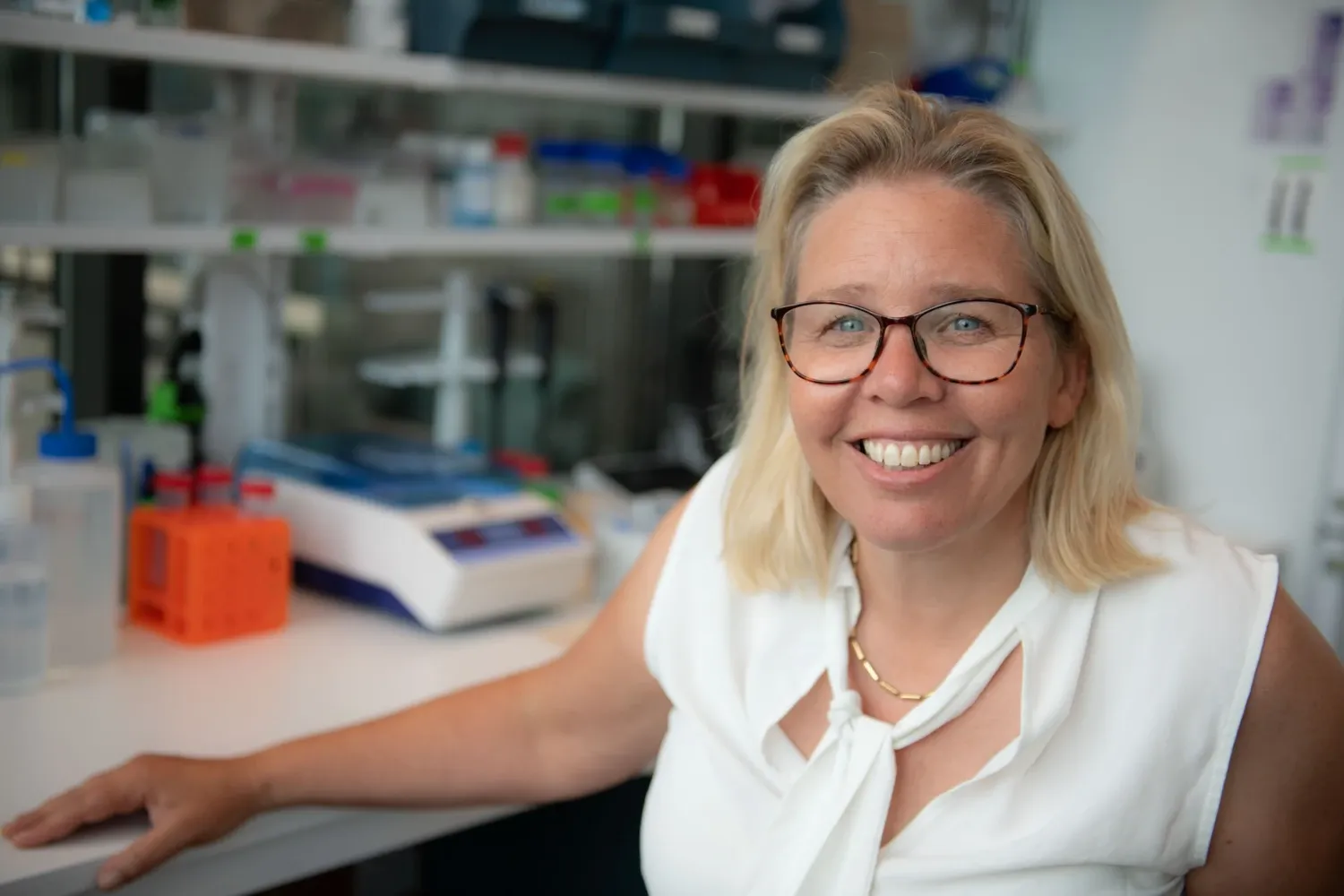 Picture of Sophie Erhardt sitting at her desk in the office