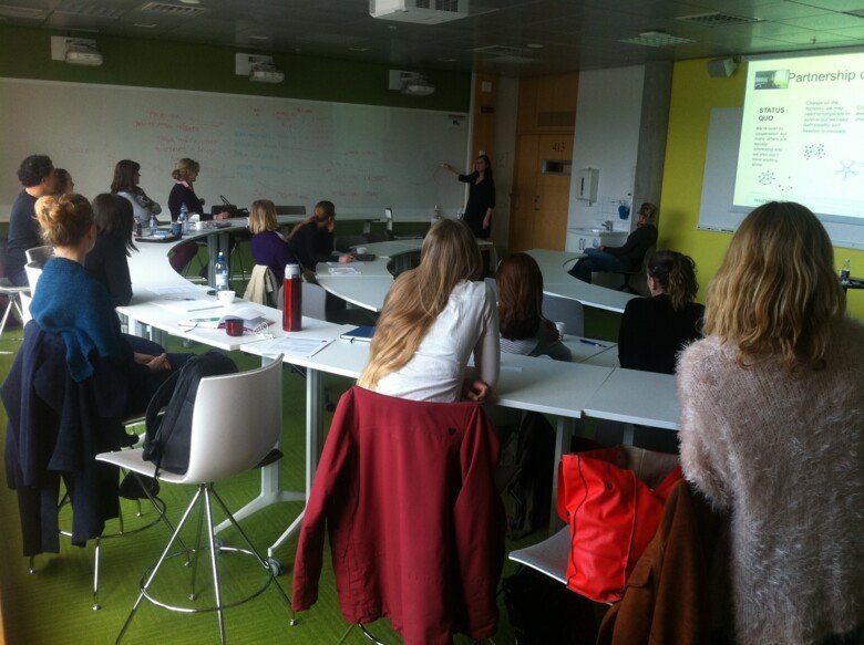 Doctoral students at a work shop.