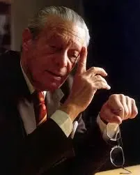 a man leaning his head on his hand