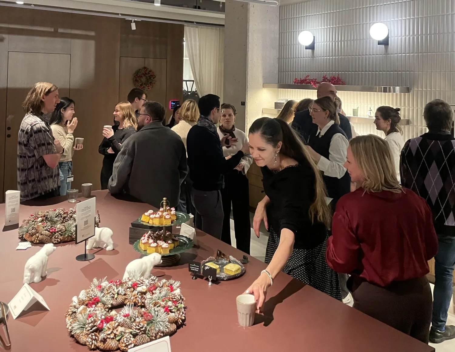 People and a table with snacks.