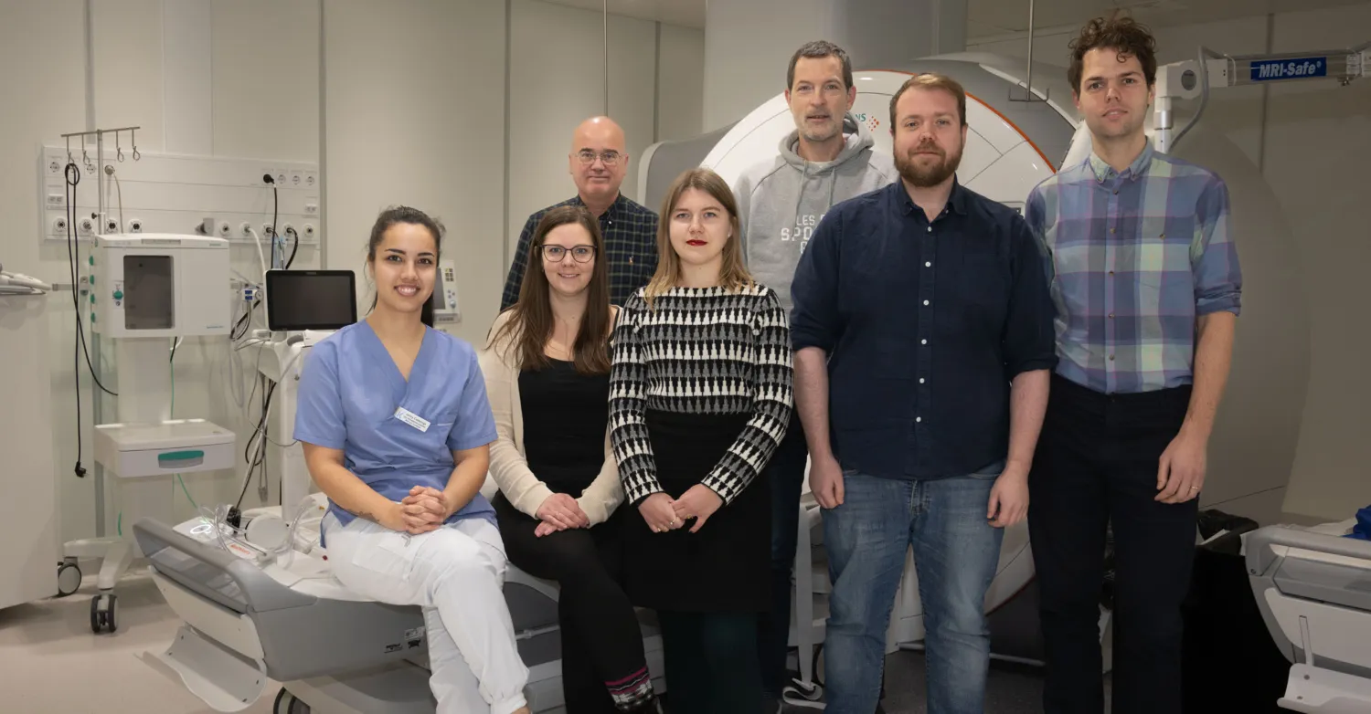 A group picture of seven researchers in hospital environment