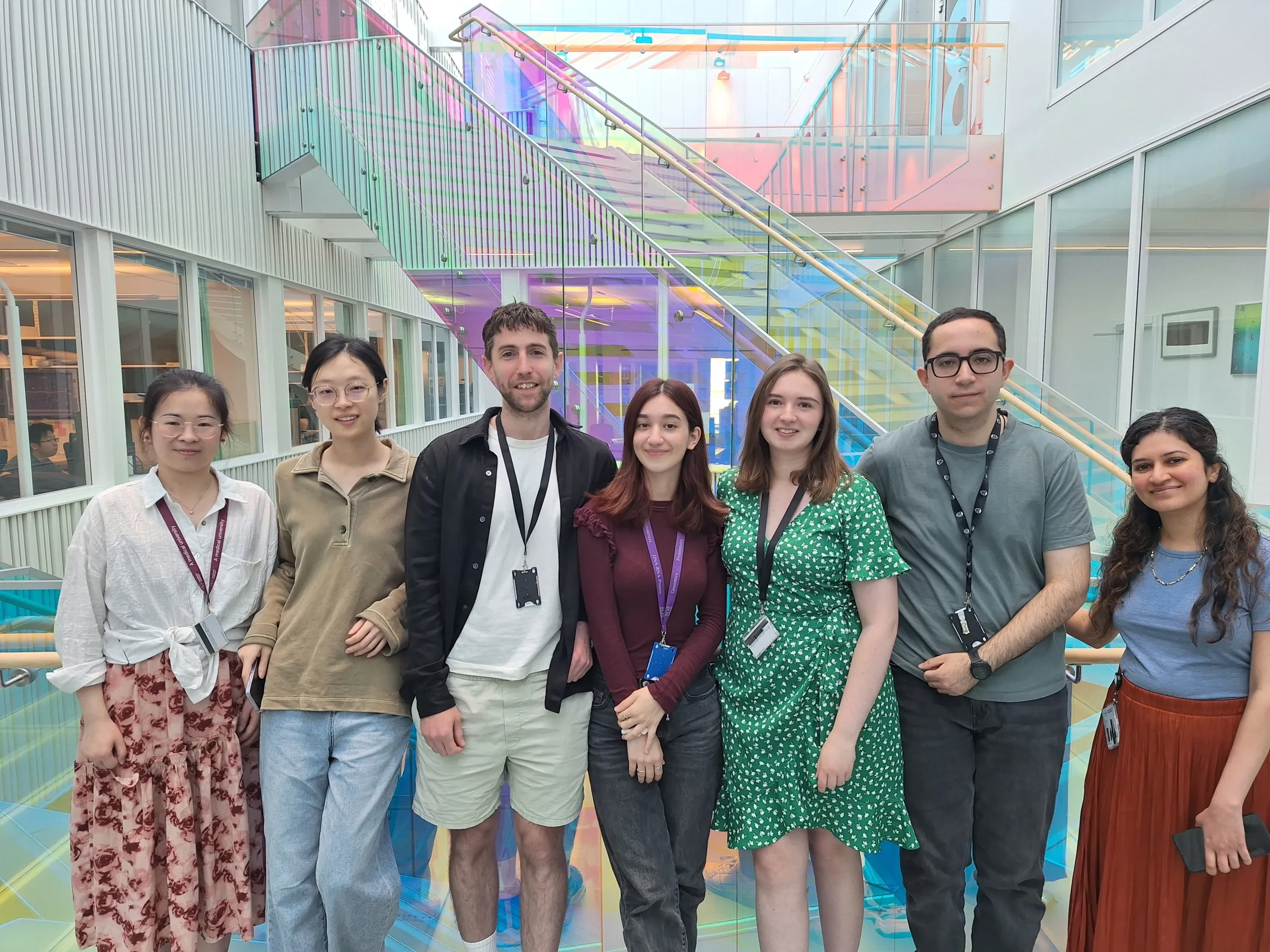 Group photo of seven people, indoors.