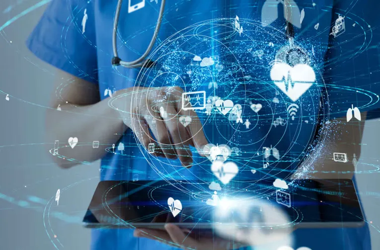 Blue tinted picture of woman on laptop. Over the whole picture there are symbols on display.