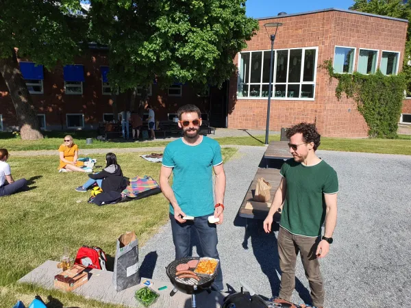People at an outside picnic/BBQ.