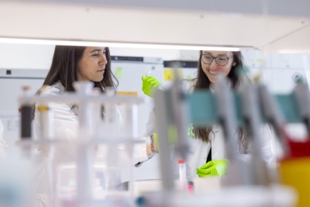 Two women working in lab environment.