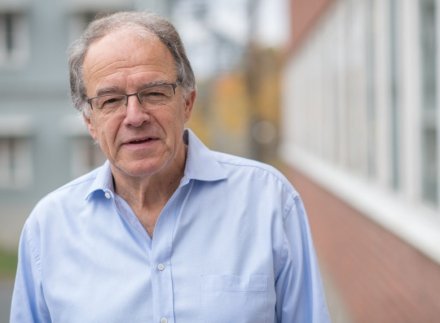 Picture on Rolf Lewensohn dressed in a blure shirt.