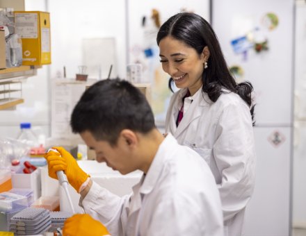 Woman and man in lab environment working together.